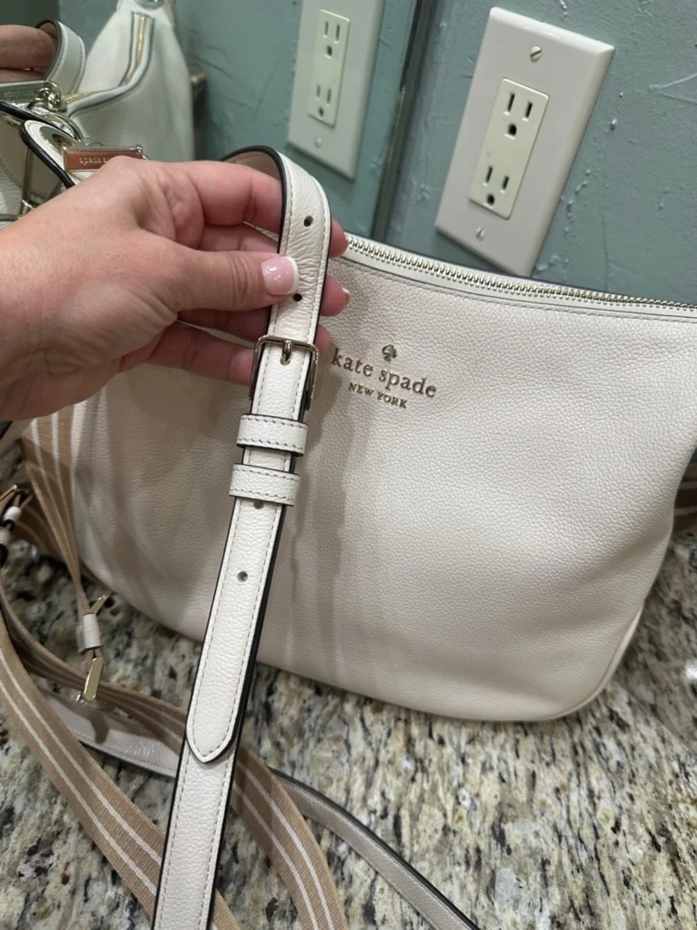 Kate Spade women’s ivory leather cross body purse or regular hand bag